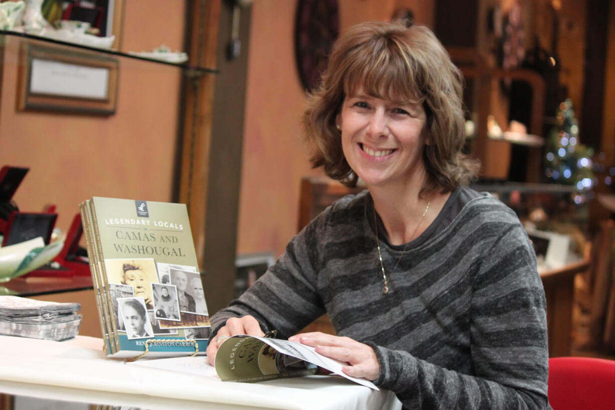 Rene' Carroll, of Washougal, signed copies of her book &quot;Legendary Locals of Camas and Washougal&quot; on Friday night at Runyan's Jewelers in downtown Camas. The book, which profiles the individuals and groups, past and present, who have had a lasting impact on the community, was officially released yesterday by Arcadia Publishing. Carroll will hold three more book signing events before Christmas.