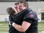 Coach Jon Eagle consoles Drew Clarkson and Matt Walser after an emotional and dejected end.