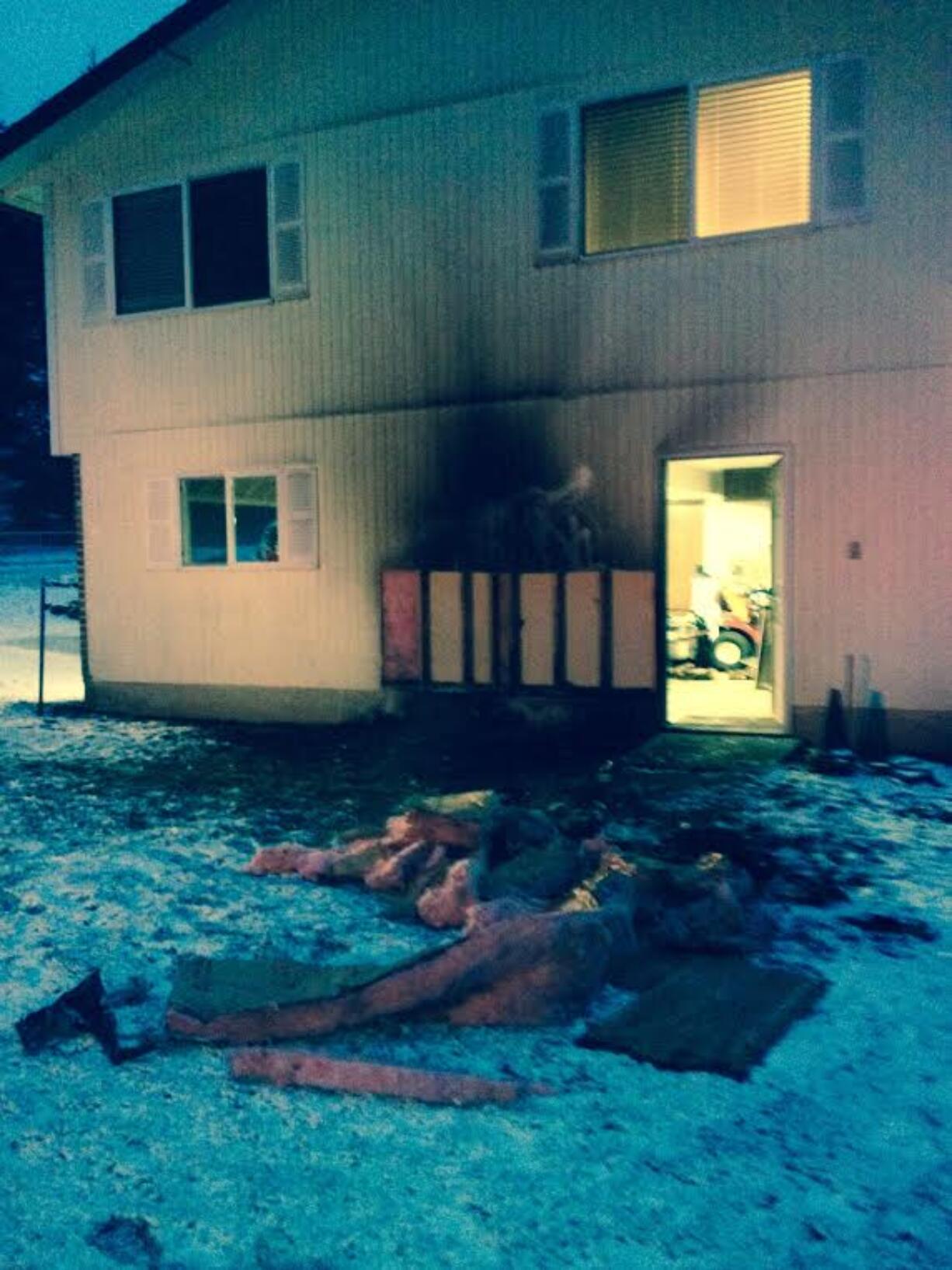 The side of a garage was damaged by fire early Tuesday morning, east of Hockinson.