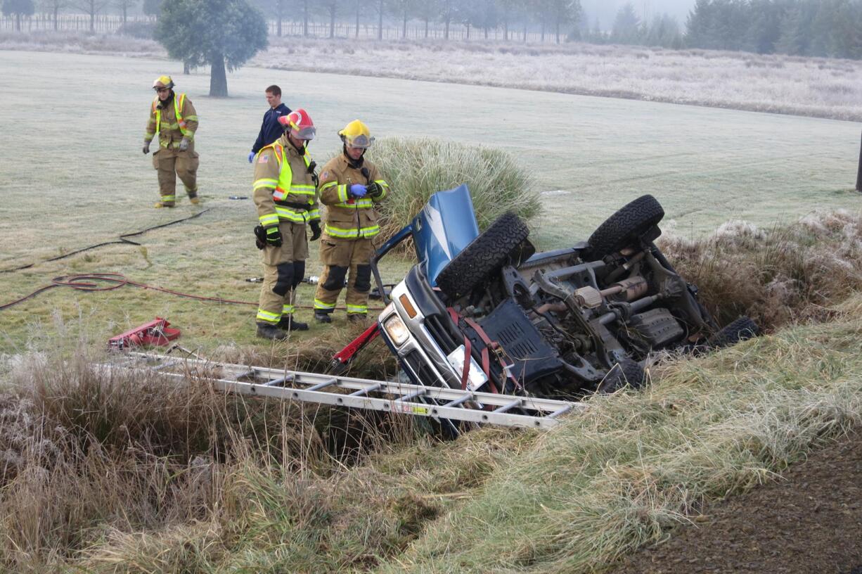 Firefighters with District 3 used tools to tear off the door of a pickup, in order to free a man trapped inside.