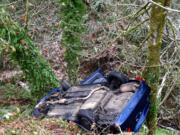 Firefighters found this vehicle suspended between two trees over an embankment near Northwest Coyote Ridge Road and Northwest 21st Avenue in La Center.