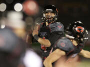 Camas quarterback Reilly Hennessey passes for a touchdown at Doc Harris Stadium.