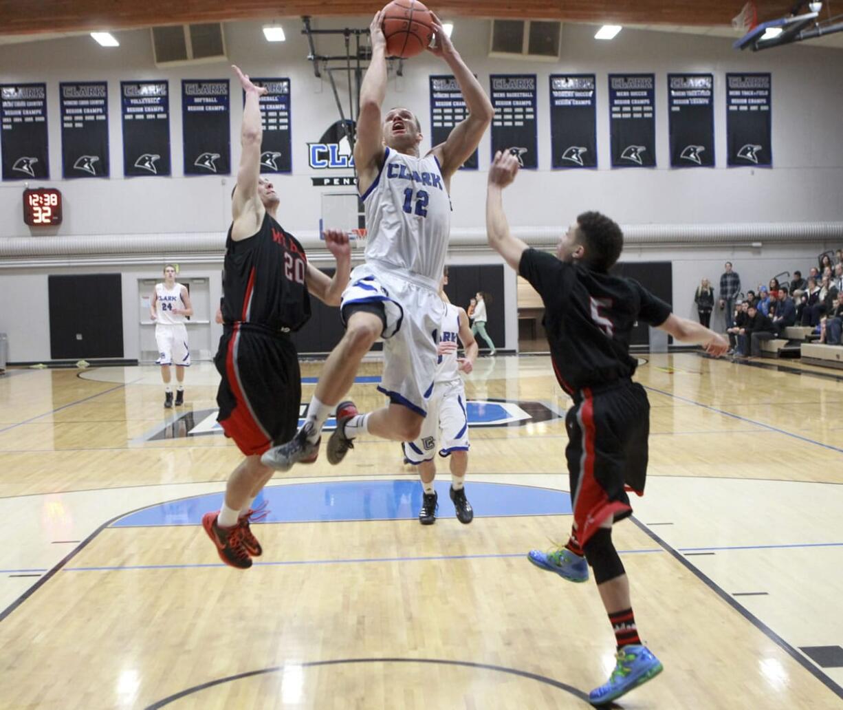 Clark College's Sean Price scores against Mt.