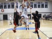 Clark College's Sean Price scores against Mt.