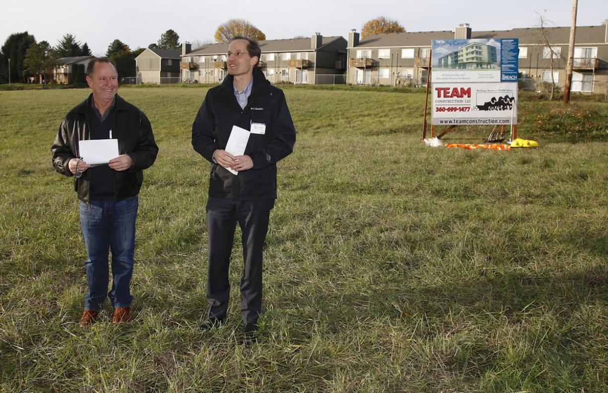 Kevin Wingate-Pearse, left, and Dan Valliere, Reach Community Development CEO, talk at a groundbreaking ceremony about Isabella Court, a future affordable housing development for seniors off Fourth Plain Boulevard. It&#039;s Reach&#039;s first construction project in Vancouver.