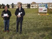 Kevin Wingate-Pearse, left, and Dan Valliere, Reach Community Development CEO, talk at a groundbreaking ceremony about Isabella Court, a future affordable housing development for seniors off Fourth Plain Boulevard. It&#039;s Reach&#039;s first construction project in Vancouver.