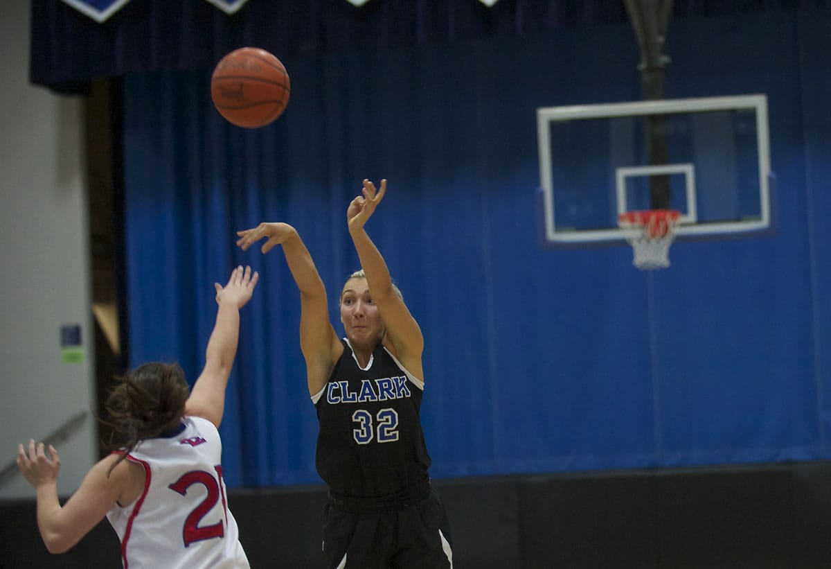 Clark's Nicolette Bond drains a three-point shot against Lower Columbia during the first half at Clark on Wednesday.