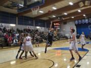 Clark's Nicolette Bond puts up a shot against Lower Columbia during the first half at Clark on Wednesday.