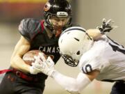 Camas' Zach Eagle carries the ball during the Papermakers' win over Bellarmine Prep on Saturday.