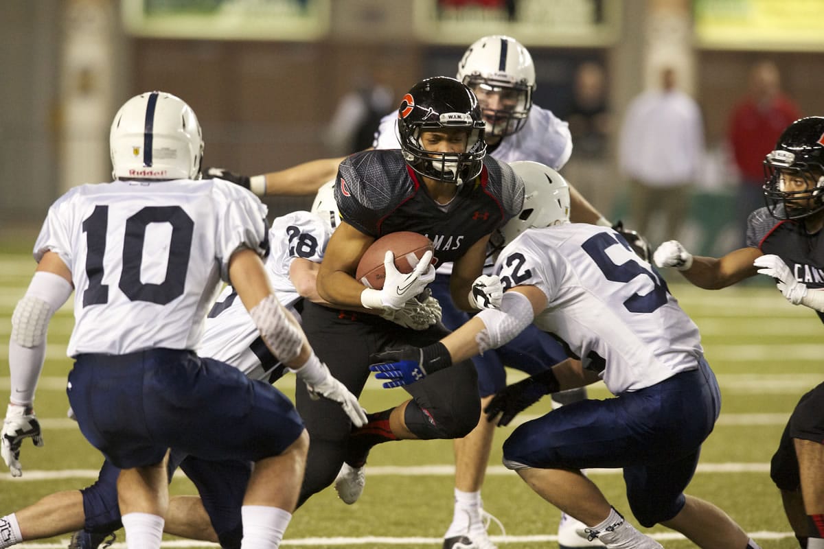 Camas' James Price carries the ball against Bellarmine Prep at the Tacoma Dome, Saturday, November 30. 2013.