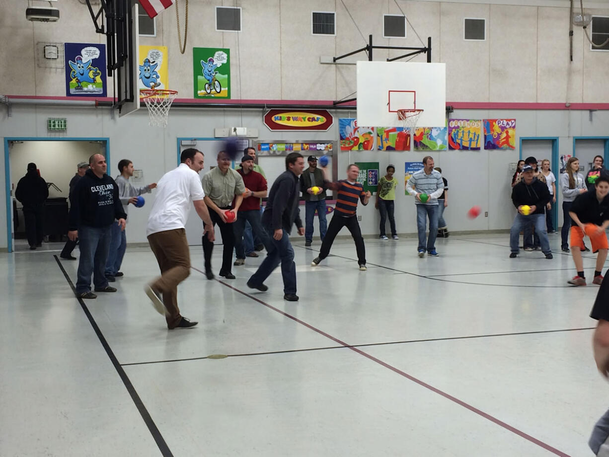 Battle Ground: Students and dads play dodgeball on the opening night of Watch DOGS at Captain Strong Primary School.