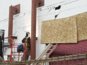 Andy Olchowy of Cleveland Enterprises welds a structural steel brace designed to reinforce a cinder block wall at Vancouver Warehouse &amp; Distribution.