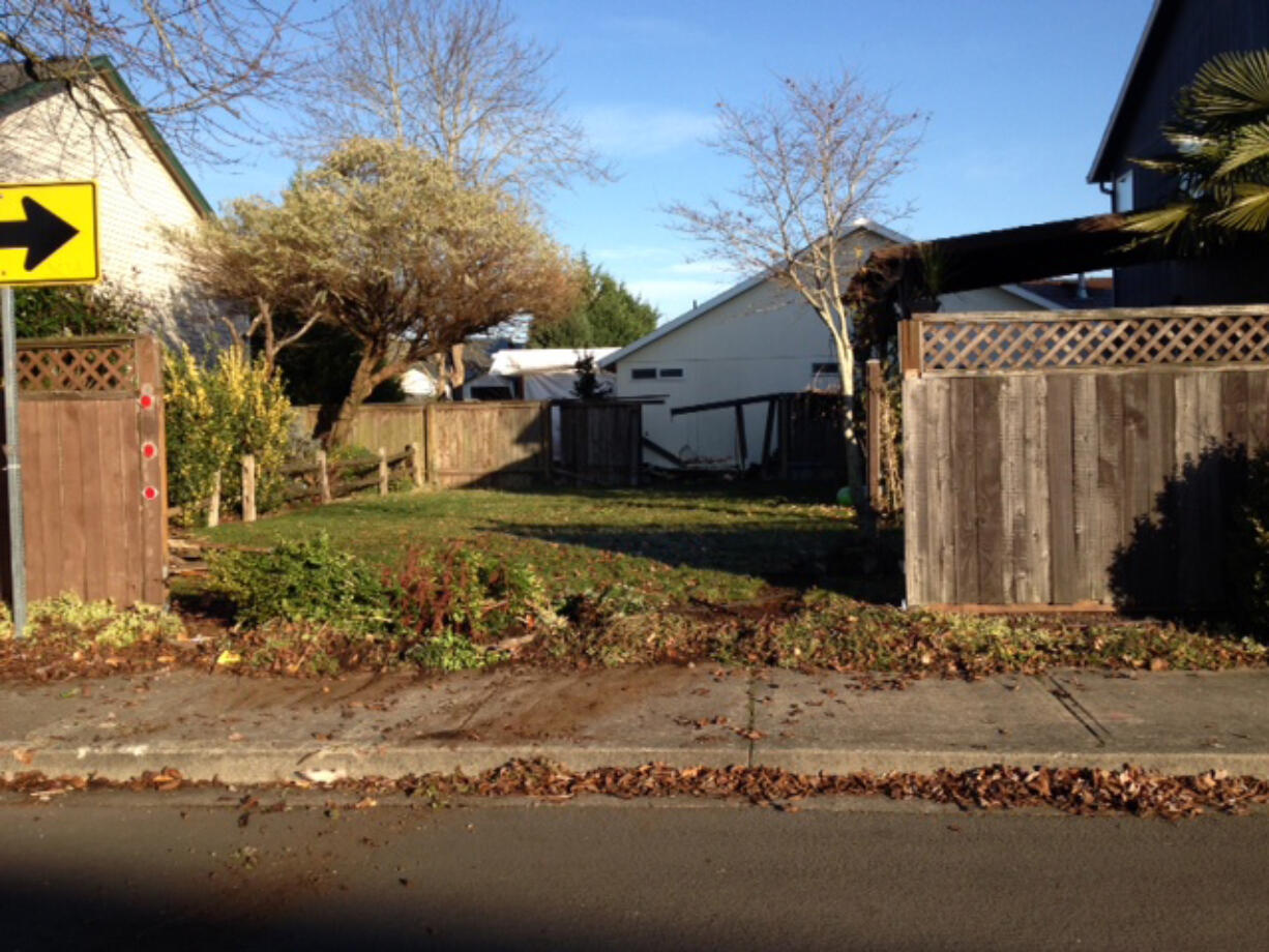 Two of Ryan Euverman's fences were damaged in November, when a vehicle missed the sharp turn on Southeast 168th Avenue.