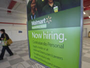 Prospective employees fill out applications and meet with Wal-Mart managers this spring as the giant retailer planned to open two stores in Clark County.