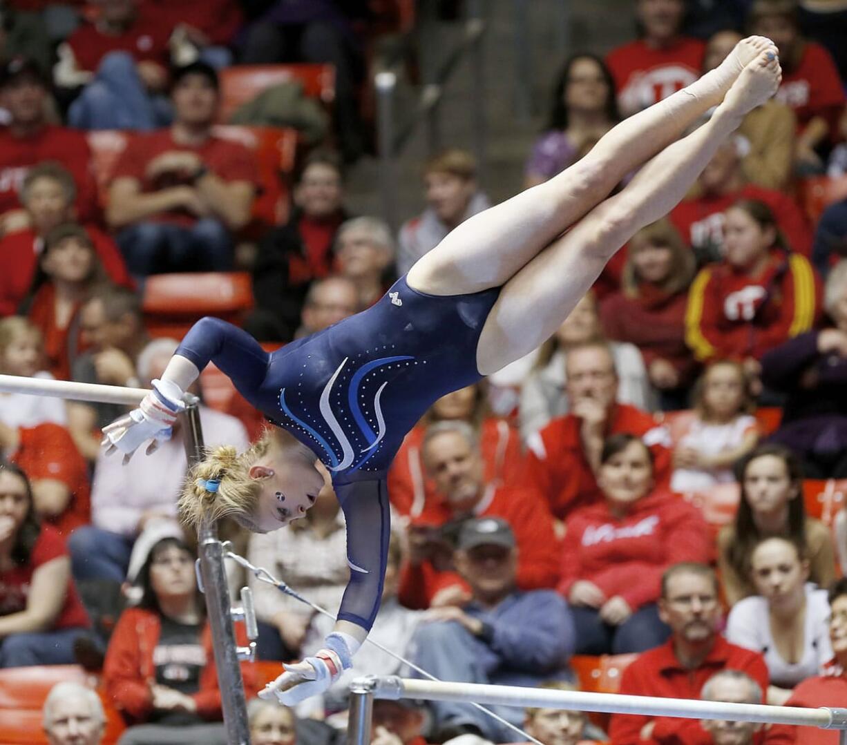 Brigham Young's KayCee Gassaway performs on the bars during a meet Jan.