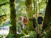 Michelle Baumann, second from left, founder of TreeSong Nature Awareness and Retreat Center, teaches children to appreciate the outdoors during a summer camp earlier this year at the newly opened Washougal center.