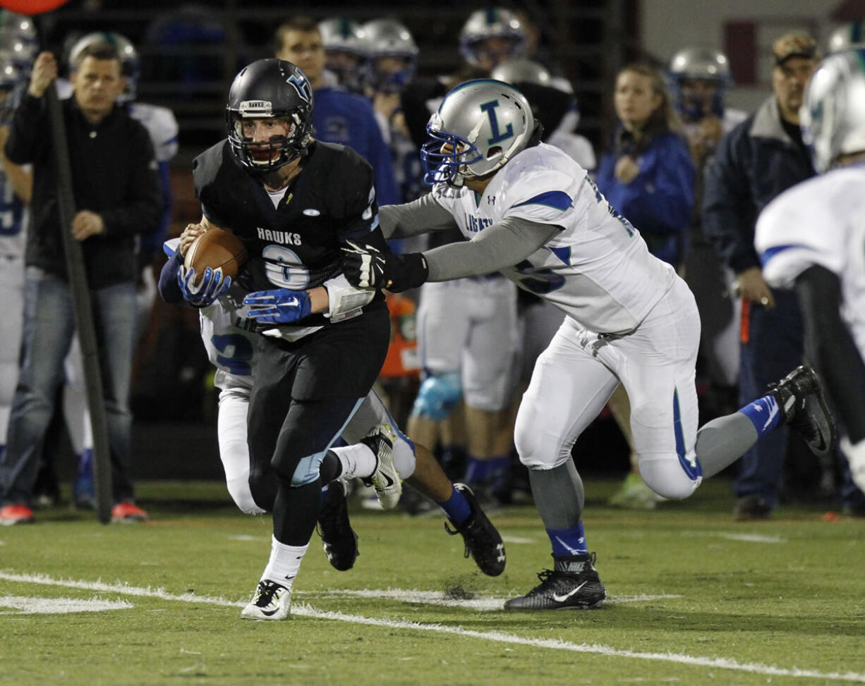 Hockinson's Mitch Lines runs ball against Liberty in the first round of the state playoffs.