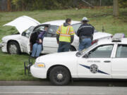 Washington State Patrol troopers investigate a traffic accident on the southbound offramp from I-5 to Mill Plain Boulevard on Tuesday.