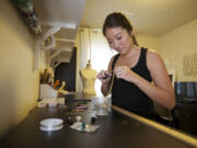 Amy Stewart, in her home workshop, is a jewelry designer with the successful Etsy store Junghwa.