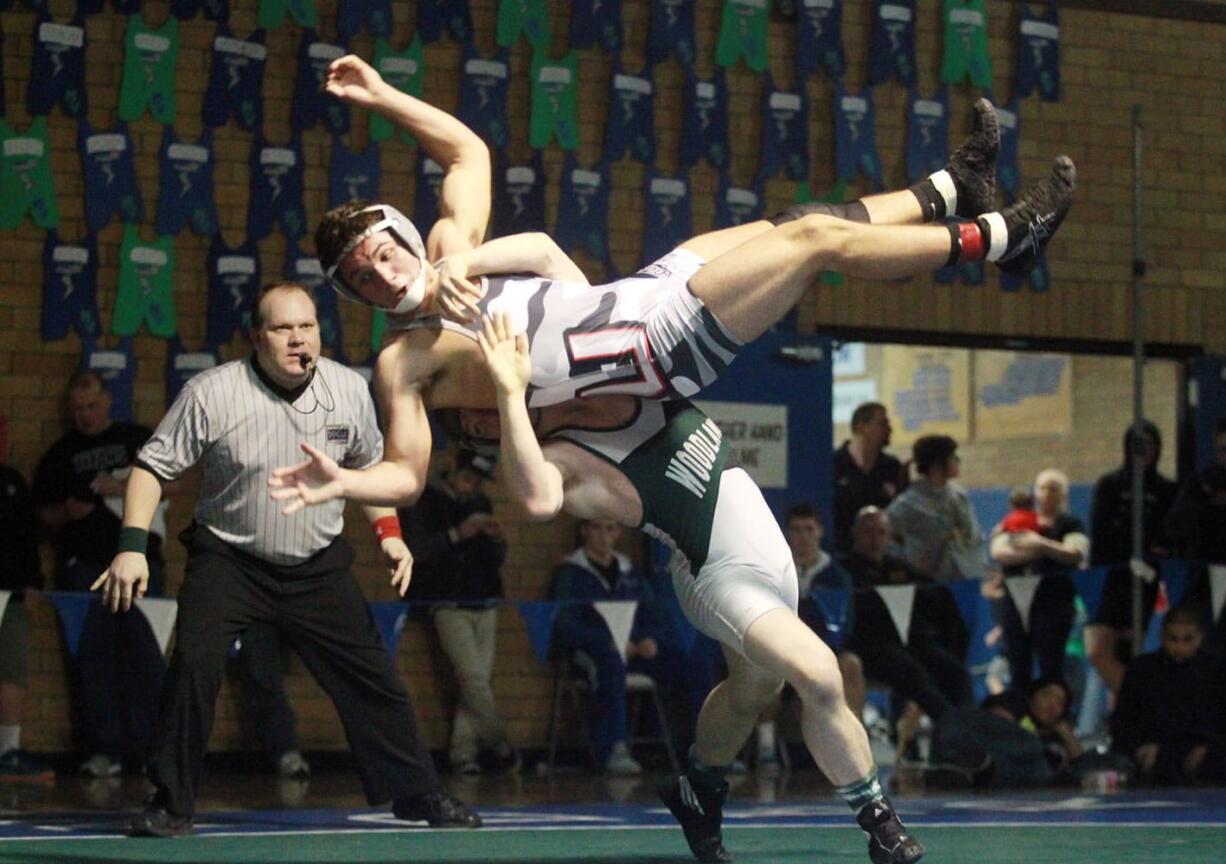 Woodland's Zac Seevers (bottom) takes down Union's Michael Snediker of Union.