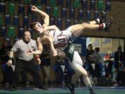 Woodland's Zac Seevers (bottom) takes down Union's Michael Snediker of Union.