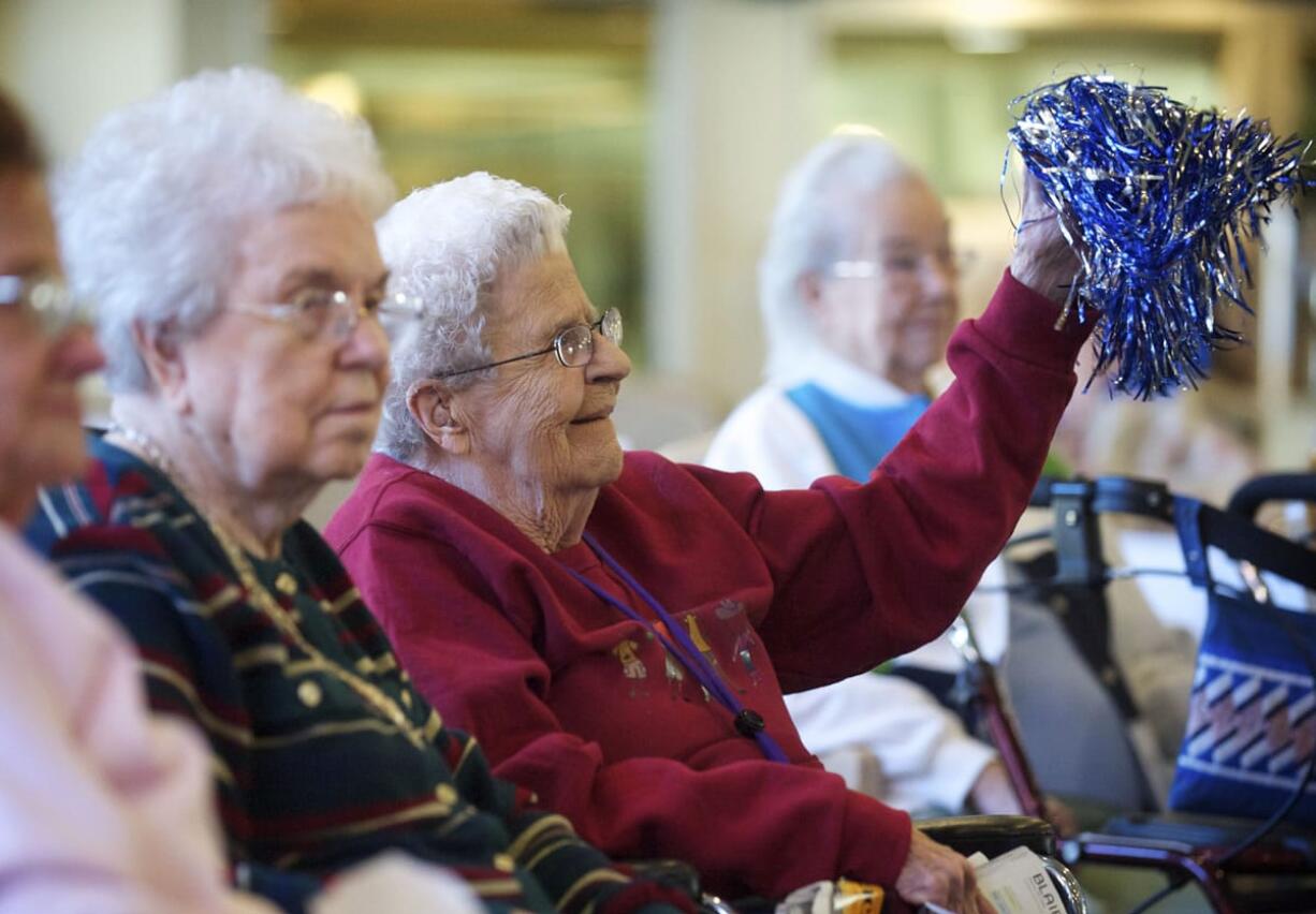 Cheerleader Marvis Nickerson, 90, helps keep the excitement crackling during bean bag baseball practice on a recent Wednesday.