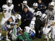 Skyview coaches and players celebrate interception by Jefferson Kiyasu over Mountain View at 4A GSHL football league tiebreaker between Skyview, Battle Ground, Mountain View.