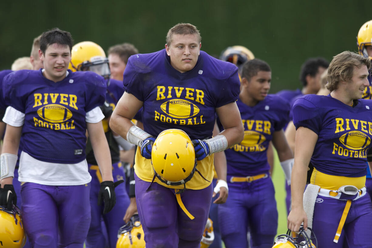 Columbia River's James Niemela, center, takes part in practice drills, Wednesday.