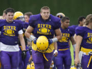 Columbia River's James Niemela, center, takes part in practice drills, Wednesday.