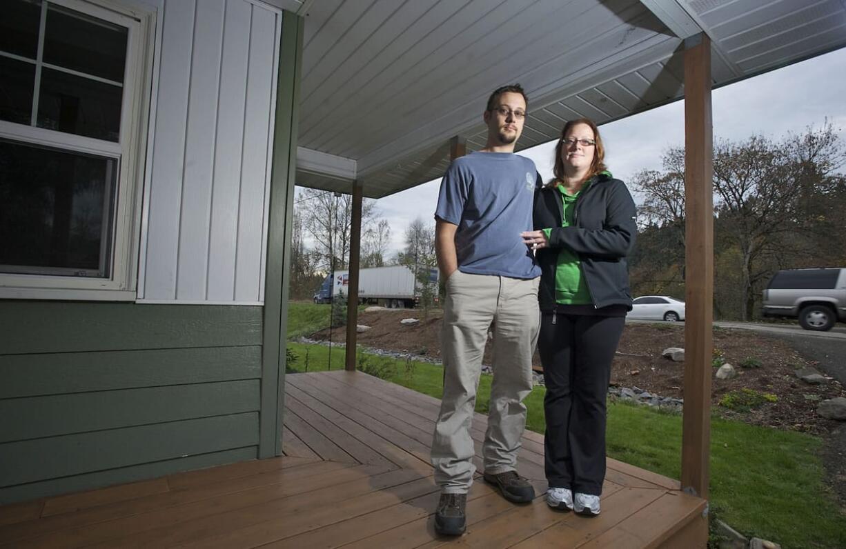 Josh and Rachel Wasser have had security issues since the county widened the street in front of their home on Northeast 119th Street.