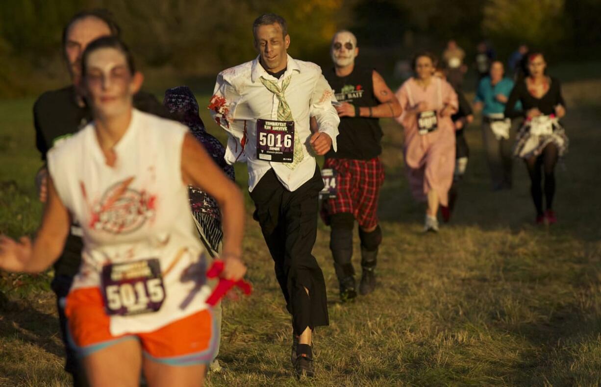 Aaron Flaxman, No. 5016, competes in the Run2Survive fun run Saturday evening.