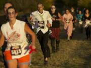 Aaron Flaxman, No. 5016, competes in the Run2Survive fun run Saturday evening.