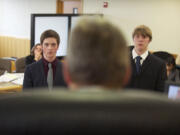 Camas High School's Max Urbanek, left, and Columbia River's Jordan Andrieu play the part of attorneys as the stand in front of Clark County Superior Court Judge Daniel Stahnke as they take part in a mock trial Thursday.