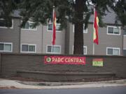 Flags fly outside the former Courtyard Village apartments in Vancouver. Units been remodeled and the complex rebranded as Parc Central.