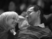 Laura Jhaveri, left, shares a moment with her husband, Akhil Jhaveri, at their daughter’s violin performance at Kennedy Violins on April 17. Akhil was diagnosed with ALS, or Lou Gehrig’s disease, in July 2011, and while he lost the ability to move his limbs, he is still trying to embrace time with his family and friends.