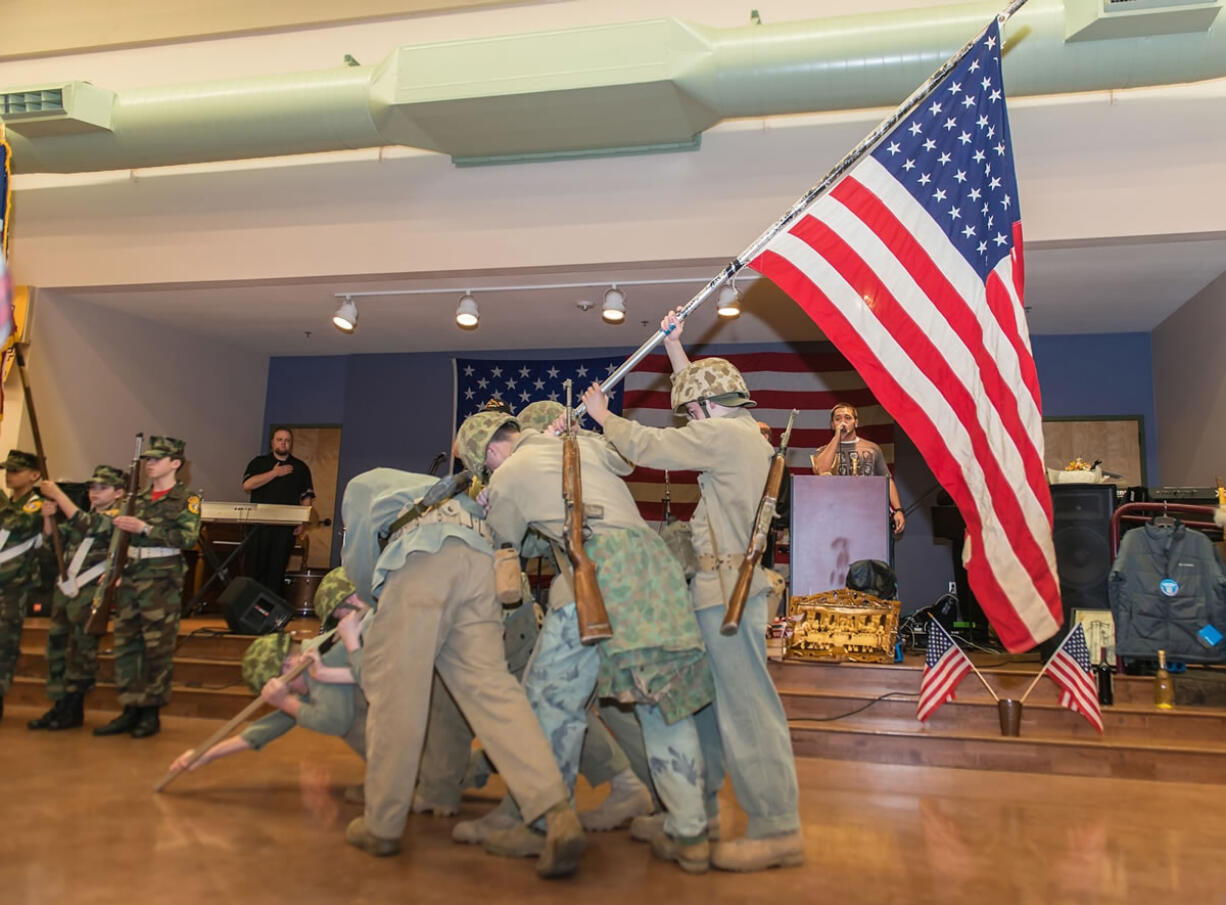 Evergreen Highlands: The Lewis and Clark Young Marines strike the famous Iwo Jima flag-raising pose at a Feb.