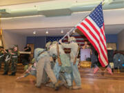 Evergreen Highlands: The Lewis and Clark Young Marines strike the famous Iwo Jima flag-raising pose at a Feb.