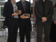 Felida: Camas High Schoolers Meghal Sheth, left, and Reesab Pathak are awarded Best of Fair honors by Bonneville Power Administration's Larry Bekkedahl on March 1 at the Southwest Washington Science and Engineering Fair, held at Columbia River High School.