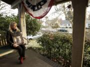 Jann Byrd holds a portrait of her oldest son, U.S. Army Maj. William F. Byrd IV, outside her Lincoln neighborhood home. In late November, Jann Byrd learned that someone had stolen her American flag from her yard.