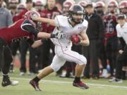 Camas running back Nate Beasley carries the ball against Eastlake at Eastlake High School, Saturday, November 23, 2013. Camas won 47-28.