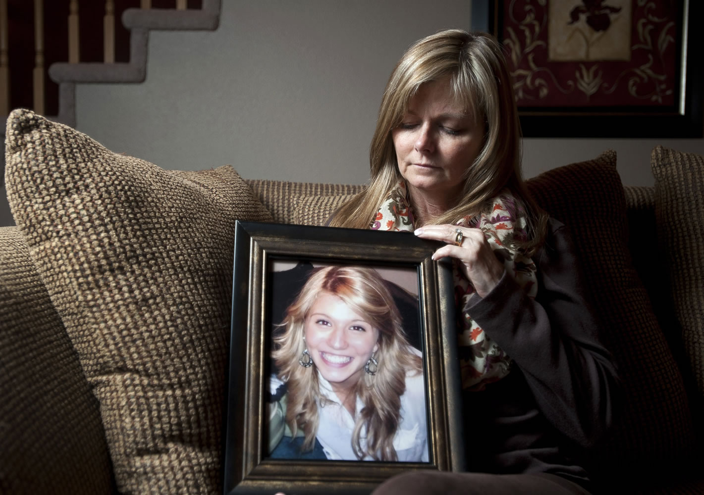 Denise Ellis holds a photograph of her 18-year-old daughter Mandy Lathim at her home in east Vancouver. Mandy, a Mountain View High School grad, died in a car crash during a road trip to California in July 2012. Denise went to great lengths to honor her daughter's wish to have her organs donated and Denise has reached out to the people who received Mandy's organs.