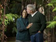 Paul and Susan Ward, outside their Meadow Glade home Friday, found on the state-based insurance exchange, Washington Healthplanfinder, a health plan with better coverage for less cost than their current plan.