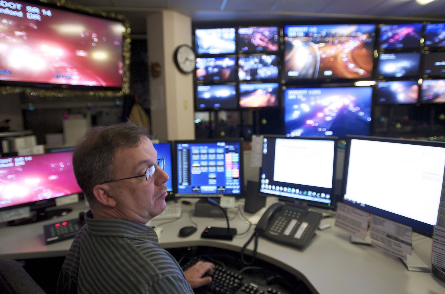 Washington State Department of Transportation dispatcher Dan Lee monitors a Dec.