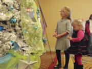 Ella Bardzik, center, and Ruby Bardziik chat with the Talking Tree at the 2014 Festival of Trees at the Hilton Vancouver Washington.