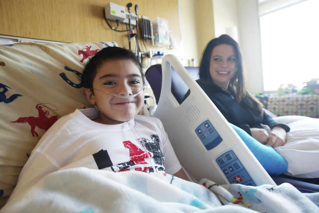 Alex Campbell, 9, with his mom, Mandy Campbell, was transported recently from Randall Children's Hospital at Legacy Emanuel in Portland to Texas Children's Hospital.