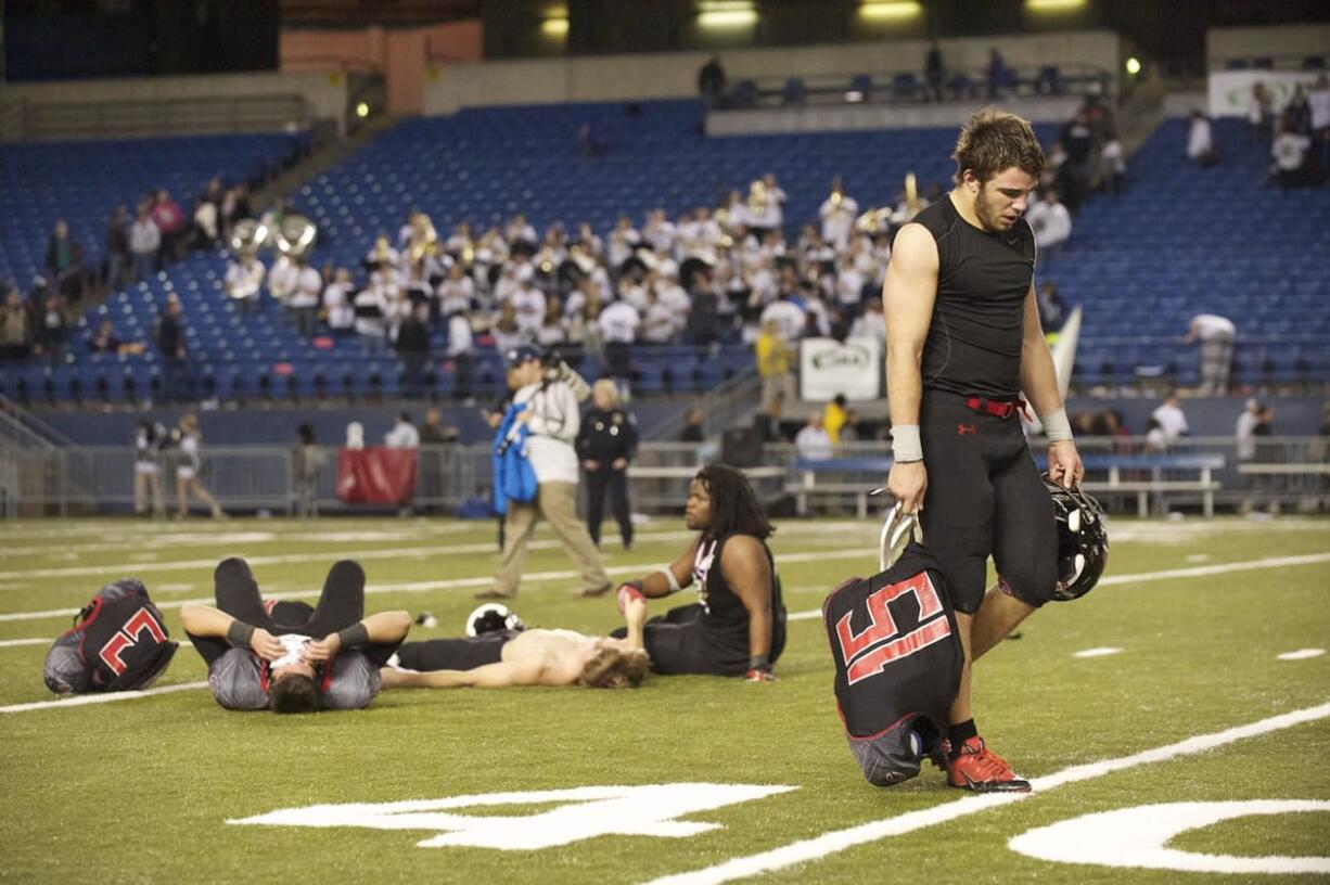 Michael Digenova leaves the field after Chiawana beats Camas to win  the State 4A championship game at the Tacoma Dome, Saturday, December 7, 2013.