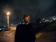 David Ellis, a volunteer armed guard, patrols Friday night in an area of downtown Vancouver where members of the homeless have been camping. An estimated 149 people live in the homeless encampment near the Share House shelter, as of Share&#039;s last count.