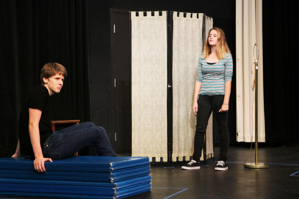 Brendan Groat stars as Scrooge and Sarah Wren as one of his guilt-tripping ghosts during a rehearsal for Battle Ground High School&#039;s upcoming adaptation of &quot;A Christmas Carol.&quot;