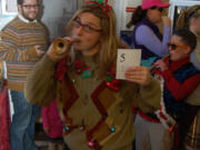 Arnada: Temple Lentz, foreground, and Erica Marchbank, right, proudly show off their garish tops for a special &quot;Ugly Sweater Saturday&quot; on Dec. 21, 2013, at the Clark County Historical Museum.