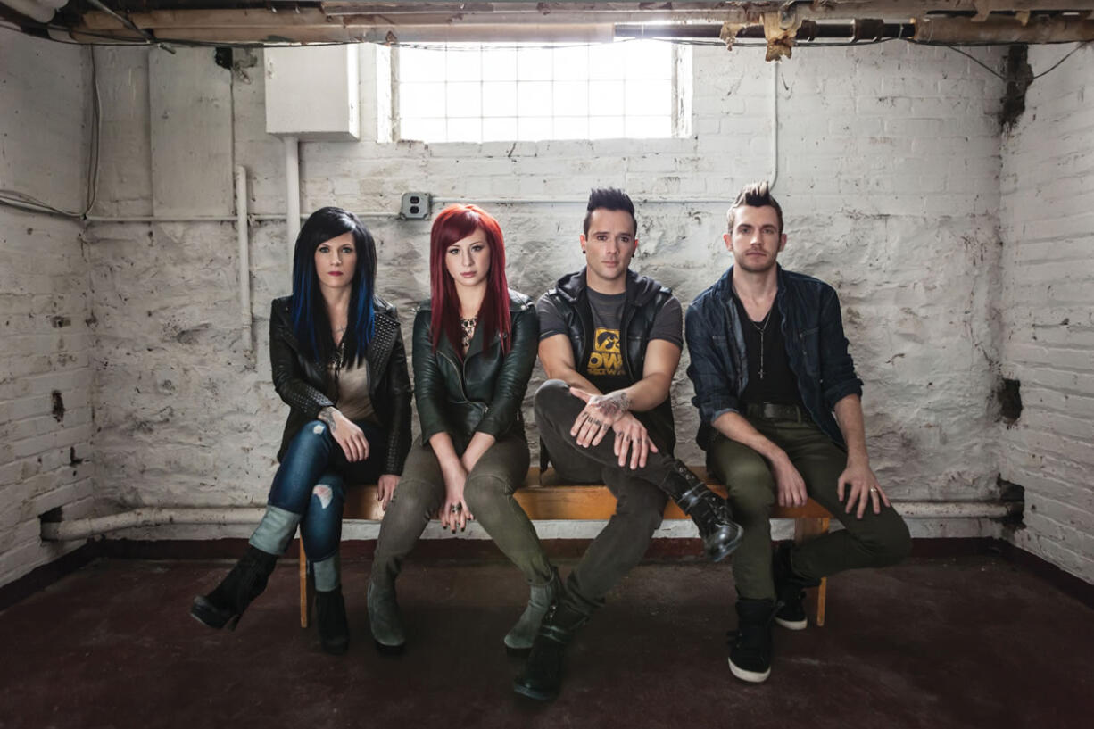 Christian rock band Skillet, from left, Korey Cooper, Jen Ledger, John Cooper and Seth Morrison, will perform Jan.